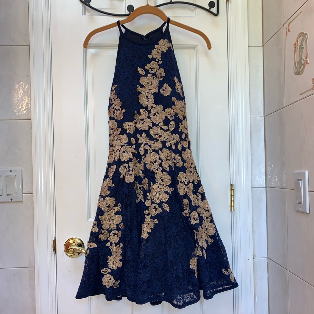 A line dress with Puff skirt and embroidery accents.
